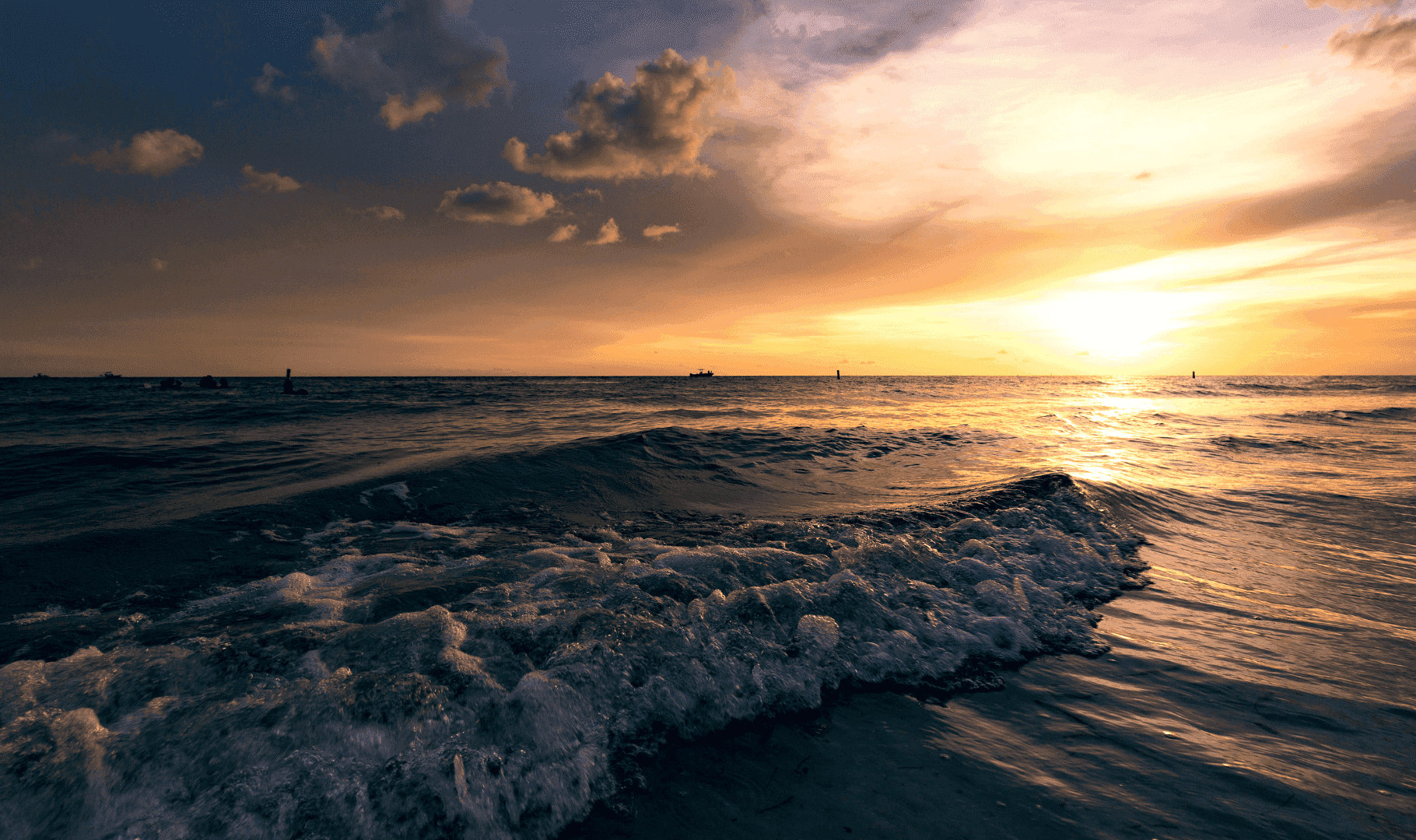 Fun and sun charter: boat and beach scene on the Gulf